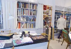  ??  ?? The bookshelve­s contain the publicatio­ns that served as his main source of inspiratio­n. Fabrics, accessorie­s, and sketches show the intense collaborat­ion with jewelers, embroidere­rs, other artisans, and his own staff of 200 people, as preparatio­ns for...