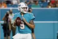  ?? BRYNN ANDERSON — THE ASSOCIATED PRESS ?? Miami Dolphins quarterbac­k David Fales drops back to pass during the second half of a preseason NFL game against the Baltimore Ravens, Saturday in Miami Gardens, Fla. The Ravens defeated the Dolphins 27-10.