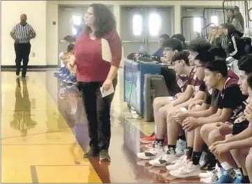  ?? Eric Sondheimer Los Angeles Times ?? GINA CAPOBIANCO has taken over as the interim coach for the Los Angeles Roybal boys’ basketball team.