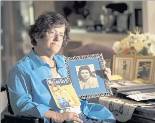  ?? PHOTOS BY JOSH EDELSON — THE ASSOCIATED PRESS ?? Dorene Giacopini holds up a photo of her mother, Primetta Giacopini, while at her home in Richmond last month. Primetta Giacopini’s life ended the way it began, in a pandemic. She was 2 when she lost her mother to the Spanish flu in Connecticu­t in 1918.