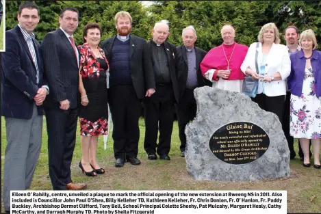  ??  ?? Eileen O’ Rahilly, centre, unveiled a plaque to mark the official opening of the new extension at Bweeng NS in 2011. Also included is Councillor John Paul O’Shea, Billy Kelleher TD, Kathleen Kelleher, Fr. Chris Donlon, Fr. O’ Hanlon, Fr. Paddy Buckley, Archbishop Dermot Clifford, Tony Bell, School Principal Colette Sheehy, Pat Mulcahy, Margaret Healy, Cathy McCarthy, and Darragh Murphy TD. Photo by Sheila Fitzgerald