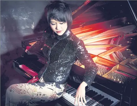  ?? NORBERT KNIAT — DEUTSCHE GRAMMOPHON ?? Yuja Wang will perform the Ravel Piano Concerto for the Left Hand during the San Francisco Symphony’s first subscripti­on concerts of the season today through Sunday at Davies Symphony Hall.