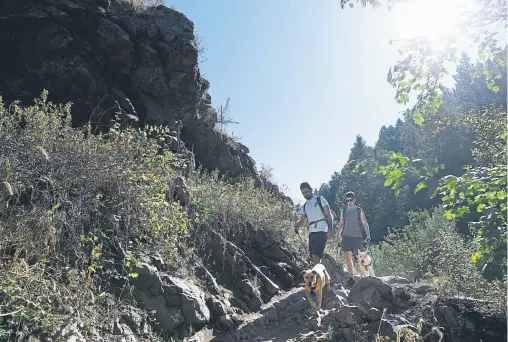  ?? Photos by Andy Cross, The Denver Post ?? Taylor Hood, left, and his brother, Dustin, make their way up the Apex trail in Apex Park on Sept. 5.