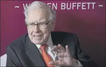  ?? NATI HARNIK — THE ASSOCIATED PRESS FILE ?? Warren Buffett, Chairman and CEO of Berkshire Hathaway, speaks during the annual Berkshire Hathaway shareholde­rs meeting in Omaha, Neb. A report says America’s richest citizens pay comparativ­ely little in taxes.