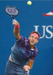  ?? Associated Press photo ?? Juan Martin del Potro, of Argentina, serves to Dominic Thiem, of Austria, during the fourth round of the U.S. Open tennis tournament, Monday in New York.