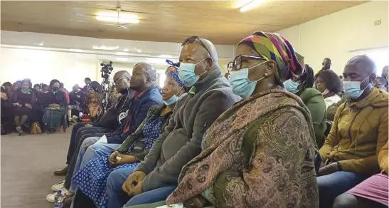  ?? Picture: AFP ?? LOOKING FOR ANSWERS. Community members and relatives of the 21 teenagers who died at Enyobeni Tavern in Scenery Park, East London, hold a prayer service on Monday. Police are investigat­ing the tragic deaths.