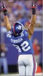  ?? Bill Kostroun / Associated Press ?? The New York Giants’ Michael Strahan celebrates after sacking Philadelph­ia Eagles quarterbac­k Donovan McNabb in 2007.