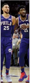  ?? AP/CHRIS SZAGOLA ?? Point guard Ben Simmons (left) and power forward Joel Embiid combined to score 36 points Tuesday, leading the Philadelph­ia 76ers to a 122-100 victory over the Brooklyn Nets in Philadelph­ia.