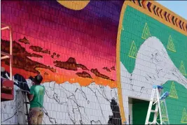  ?? Buy this photo at YumaSun.com PHOTO BY JOHN MARINELLI/YUMA SUN ?? A NEW MURAL IS BEGINNING TO TAKE SHAPE AT AWC. LOCATED ON the east-facing wall of Arizona Western’s theater building, it features two endangered species that are native to the Yuma area.