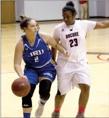  ?? Photo submitted ?? John Brown freshman Sara Williams, left, brings the ball up the floor against Bacone (Okla.) on Thursday.
