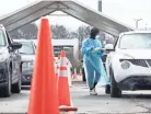  ?? STEPHANIE AMADOR / THE TENNESSEAN ?? Tennessee Army National Guard member Galaka Willow collects the patients’ informatio­n at a testing and vaccinatio­n site in Nashville on Jan. 3.