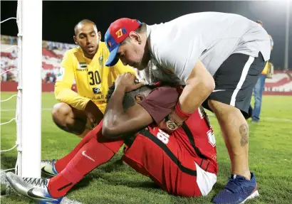  ?? Reuters ?? Al Fujairah’s manager Diego Maradona consoles a player after a draw against Khor Fakkan saw their team missing out the automatic promotion to the Arabian Gulf League. —