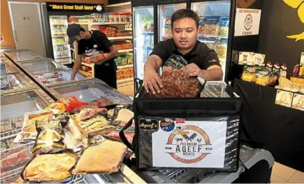  ?? — Zhafaran nasib/the Star ?? Brisk business: nazrul packing frozen meat and cooking ingredient­s at his shop in Kepala batas, Penang.