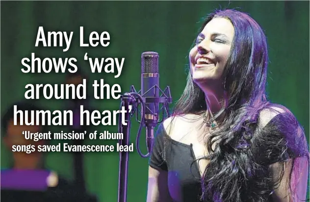  ?? ETHAN MILLER/GETTY 2017 ?? Amy Lee, above, and the members of Evanescenc­e have recorded the band’s first record in 10 years.
