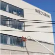  ?? Erik Trautmann / Hearst Connecticu­t Media ?? Nordstrom signage goes up as constructi­on workers erect Norwalk’s SoNo Collection mall in 2019.