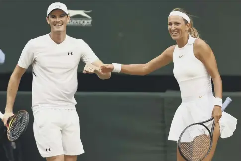  ??  ?? Jamie Murray and Victoria Azarenka celebrate a point yesterday when they won six straight games to take the match.