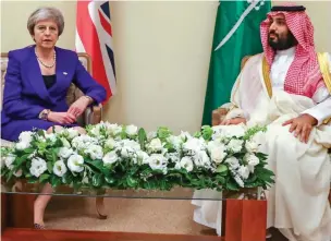  ??  ?? Old friends: Putin smiles warmly at the Saudi leader ‘Pulling no punches’: Theresa May meets prince for talks at summit