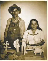 ?? PALACE OF THE GOVERNORS PHOTO ARCHIVES NEG # 041710 ?? Wood-carver George Lopez and his wife in Cordova, New Mexico, ca. 1940