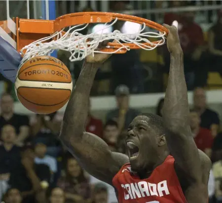  ?? RICK MADONIK/TORONTO STAR ?? WITH AUTHORITY Canada’s Anthony Bennett throws down an emphatic slam dunk against the U.S. in men’s basketball semifinal action at the Pan Am Games Friday. Canada won 111-108 in overtime to advance to Saturday’s gold medal final.