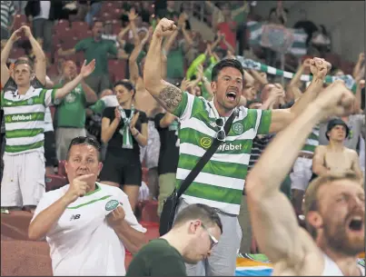  ??  ?? Celtic fans celebrate in Israel after the club clinched qualificat­ion