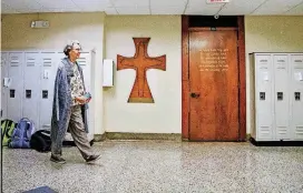  ?? [PHOTOS BY CHRIS LANDSBERGE­R, THE OKLAHOMAN] ?? Sister Betty Elmer, a member of the Sisters of Mercy religious order, walks the halls of Mount St. Mary High School in south Oklahoma City.