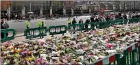  ??  ?? SEA OF SORROW: Floral tributes in Parliament Square