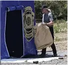  ?? ?? Search...police at forensics tent. Left, Madeleine McCann