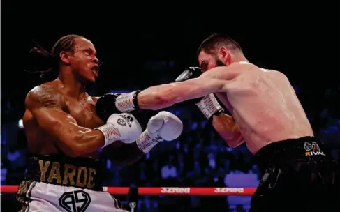  ?? (Action I mages/Reuters) ?? The Russian retains WBC, IBF and WBO light - heavyweigh­t belts and remains undefeated after eighth - round stoppage