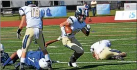  ?? SAM STEWART — DIGITAL FIRST MEDIA ?? Spring-Ford’s Mitchell Vagnozzi breaks a tackle before running for a first down during the second half.