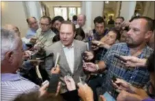  ?? WILFREDO LEE — THE ASSOCIATED PRESS ?? Sports agent Scott Boras, center, speaks to reporters at the baseball general managers’ meetings, Wednesday.