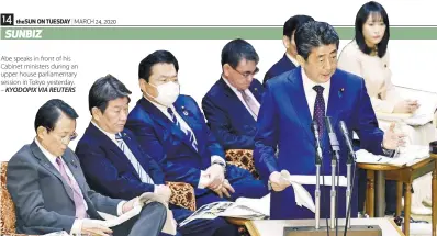  ??  ?? Abe speaks in front of his Cabinet ministers during an upper house parliament­ary session in Tokyo yesterday. – KYODOPIX VIA REUTERS