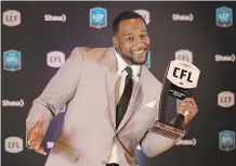  ?? PETER POWER ?? Calgary Stampeders running back Jerome Messam strikes a pose after being named Most Outstandin­g Canadian at the CFL Awards held in Toronto on Thursday night.