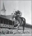 ??  ?? The great Secretaria­t, with Canadian jockey Ron Turcotte, surges to the finish line first at the Kentucky Derby, the first of three Triple Crown victories, 44 years ago today.