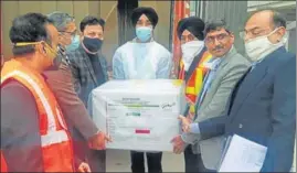  ?? HT PHOTO ?? A consignmen­t of Covishield vaccine arriving at the Chandigarh Internatio­nal Airport from Mumbai on Wednesday. The flight brought 21 boxes that were handed over to Haryana’s department of health and family welfare.