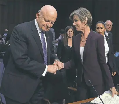  ?? Chip Somodevill­a/Getty Images ?? James Clapper, former director of national intelligen­ce and Sally Yates, former acting U.S. attorney general, shake hands Monday after testifying before the Senate Judiciary Committee’s Subcommitt­ee on Crime and Terrorism on Capitol Hill in Washington,...
