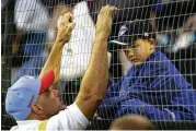  ?? GENE J. PUSKAR / AP 2005 ?? Former major leaguer Dante Bichette (left) with his son Bo, 7, before coaching his older son Dante Jr.’s at the Little League World Series in 2005.