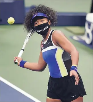  ?? NAOMI OSAKA Frank Franklin II Associated Press ?? brought awareness to social justice, wearing police shooting victim Breonna Taylor’s name on her mask at the U.S. Open. Osaka beat Victoria Azarenka in the final on Sept. 12.