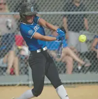  ?? ?? Lincoln-Way East’s Maddie Pomykalski swings at a pitch against Shepard.