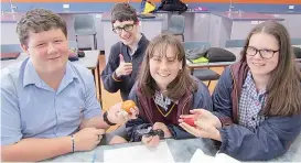  ??  ?? Drouin Secondary College students experiment­ing with fruit in their Year 9 Agricultur­e class in 2019.