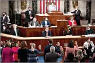  ?? (Bill Clark/Pool Photo via AP, File) ?? House Speaker Nancy Pelosi administer­s the oath of office to members of the 117th Congress on Jan. 3 at the U.S. Capitol in Washington.