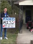  ?? PHOTO PROVIDED ?? A WSTLC teacher holds a sign with a message for his students during Thursday’s caravan.