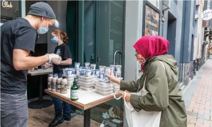  ?? Photograph: Asanka Ratnayake/Getty Images ?? A student collects food from Melbourne charity Alex Makes Meals. Charities report growing numbers of internatio­nal students and casual workers asking for food relief.