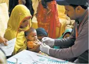  ?? RIZWAN TABASSUM/GETTY-AFP ?? A Pakistani paramedic takes a blood sample from a baby for an HIV test at a state-run hospital in Ratodero.