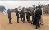  ?? PICTURE: REUTERS ?? Boko Haram militants embrace and shake hands with Boko Haram prisoners, released in exchange for a group of 82 Chibok girls, who were held captive by Islamist militants, near Kumshe, Nigeria, in May.