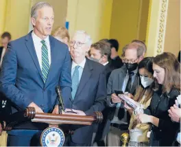  ?? MARIAM ZUHAIB/AP ?? Senate Minority Leader Mitch McConnell of Ky., second from left, listens as Sen. John Thune, R-S.D., speaks during a news conference on April 26 in Washington.
