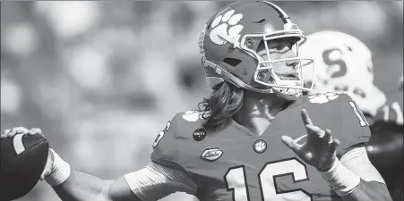  ?? AP ?? Clemson quarterbac­k Trevor Lawrence, pictured in action against Syracuse on Oct 24, missed his team’s victory over Boston College on Saturday after testing positive for the coronaviru­s and will also sit out this weekend’s big game against Notre Dame.