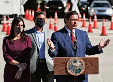  ?? JOE RAEDLE/GETTY IMAGES ?? Florida Gov. Ron DeSantis speaks last week about the opening of a COVID-19 vaccinatio­n site at the Hard Rock Stadium in Miami Gardens, Fla. Vaccinatio­ns will be available for residents 65 and older who can drive up in the parking lot.