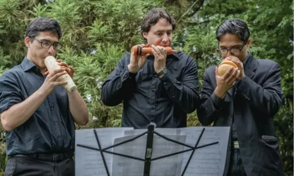  ?? JOHNNY MILANO PHOTOS/THE NEW YORK TIMES ?? The Long Island Vegetable Orchestra — from left: Solomon Elyaho, Daniel Battaglia and David Elyaho — tours schools, galleries, libraries and more.