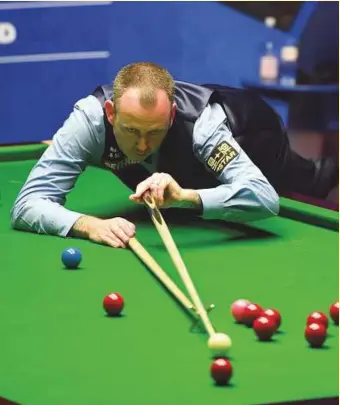  ?? AFP ?? ■ Wales’s Mark Williams on his way to an 18-16 win against Scotland’s John Higgins during the World Championsh­ip final in England. He claimed his third world snooker crown on Monday.