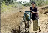  ??  ?? In search of a precious commodity: A woman returns home with some drinking water placed on her bicycle in drought-stricken Puttalam District. Pic by Hiran Priyankara